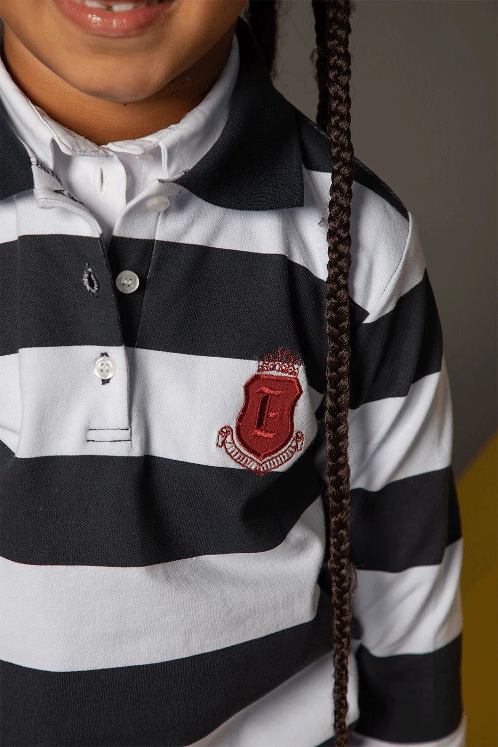 Blue and white striped polo shirt with long sleeves