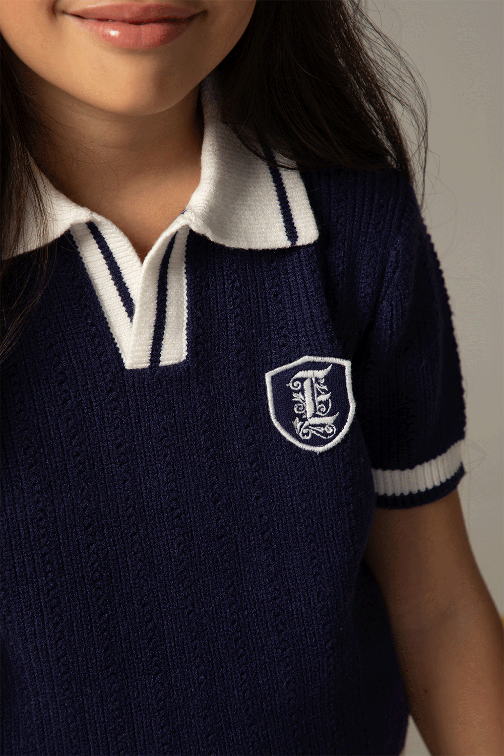 Navy knitted top with contrasting details
