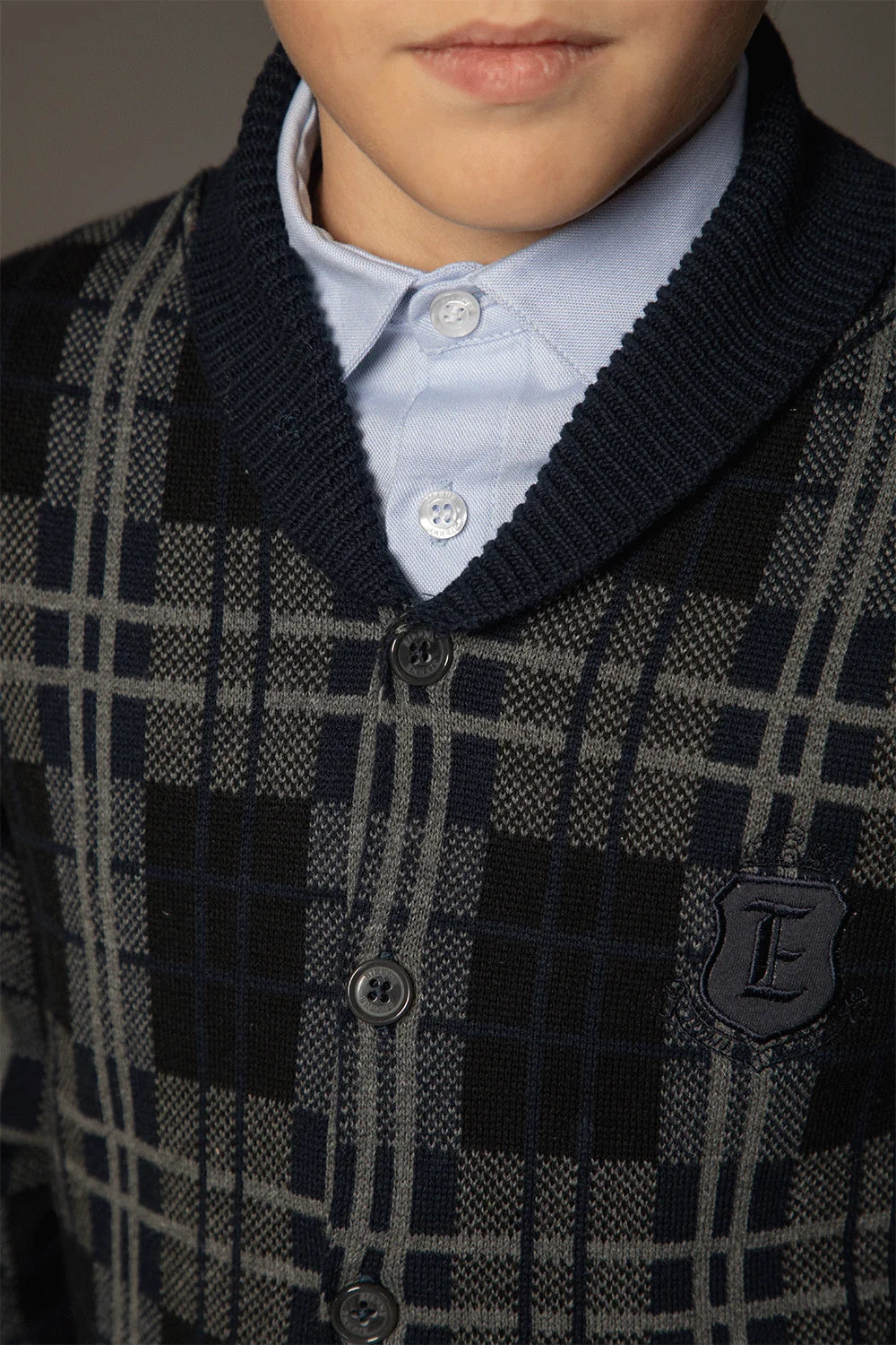 Dark grey and navy checked cardigan with a shawl collar, front button fastening and embroidered logo