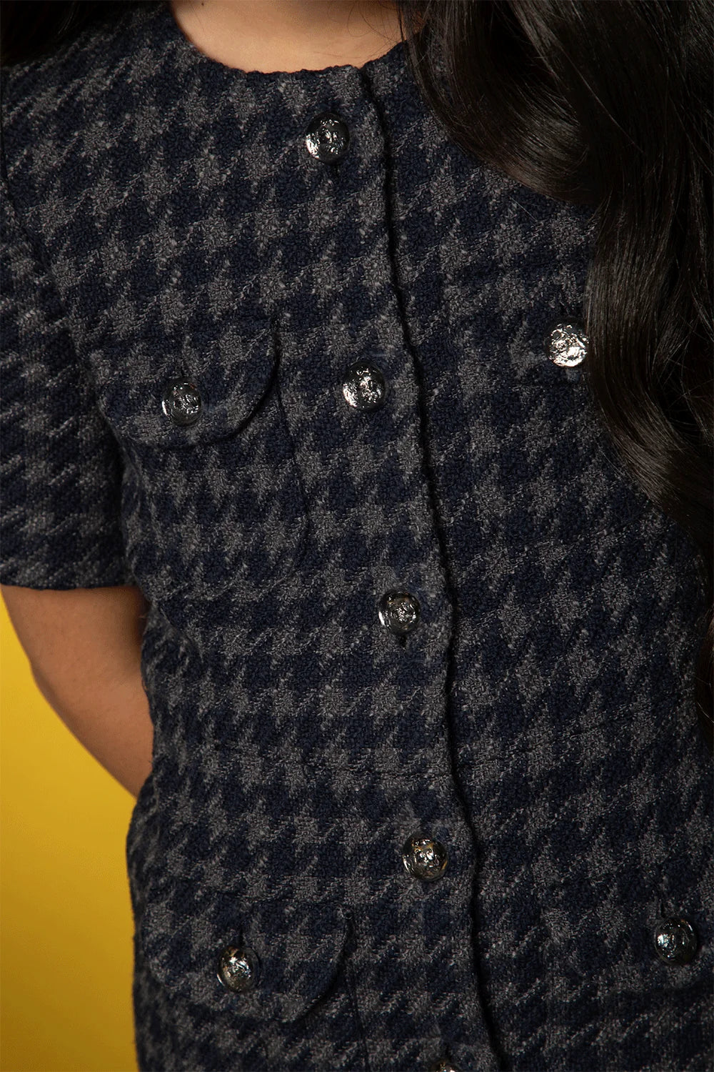 Elegant blue-grey checked dress with front buttons and pockets