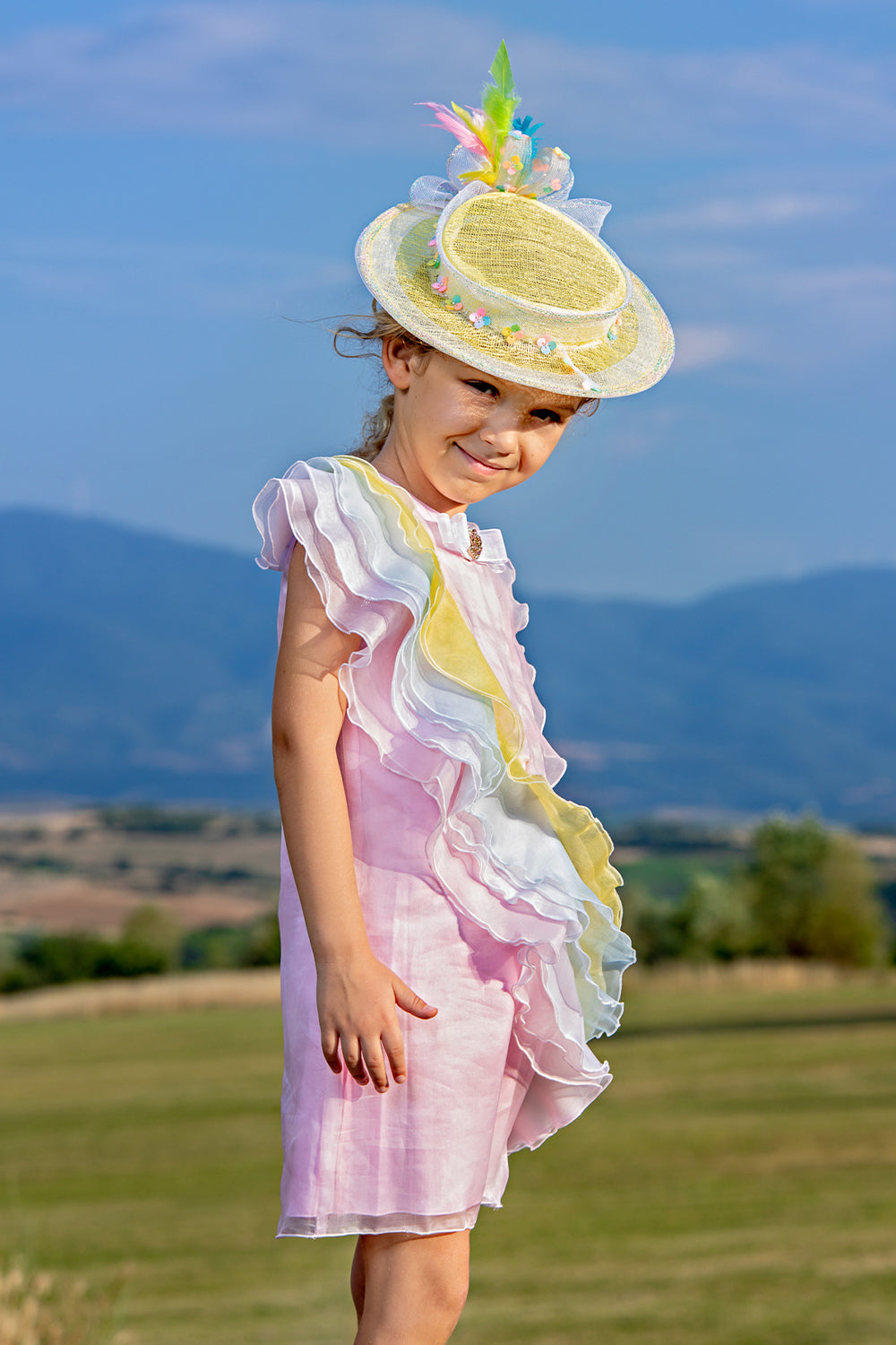 Pink silk organza dress with pastel silk frills and bow with Swarovski button