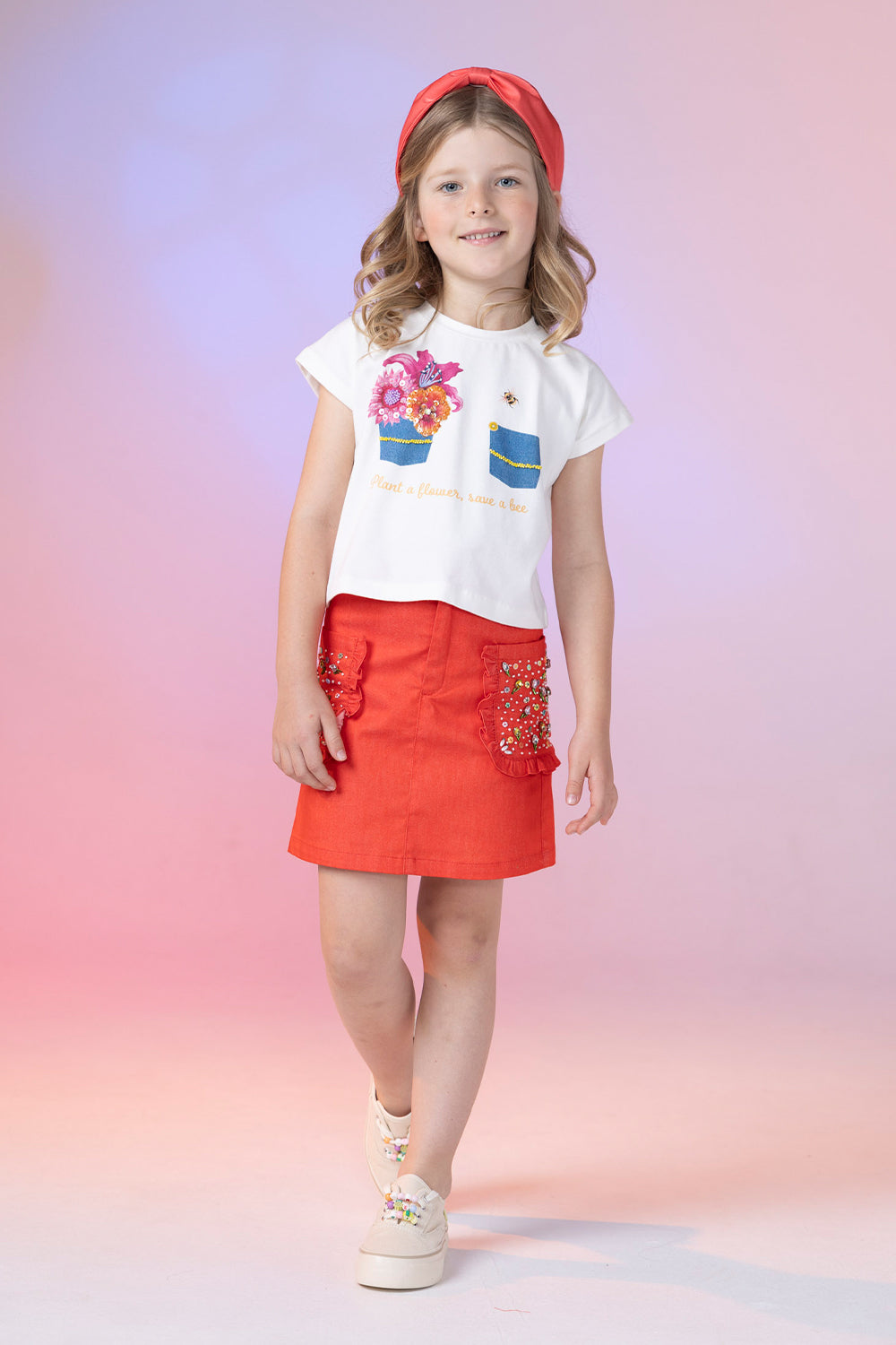 Red mini denim skirt with hand-made decoration