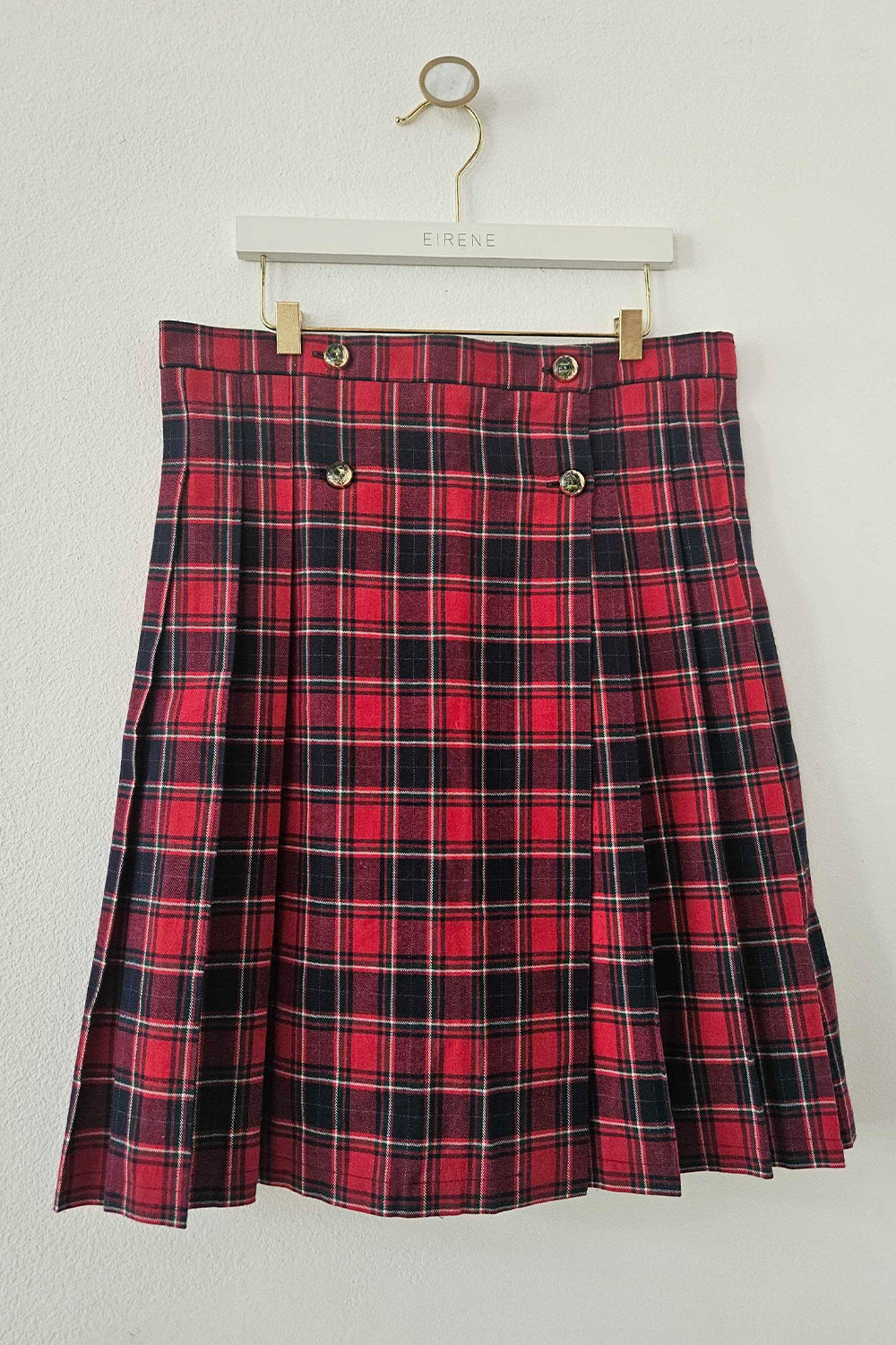 Red pleated cotton check skirt with gold coat of arms buttons