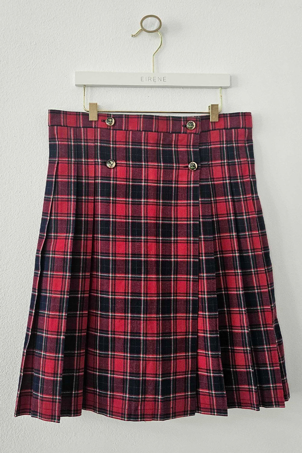 Red pleated cotton check skirt with gold coat of arms buttons