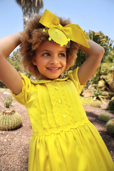 Bright yellow satin dress with pretty front detail, collar and puffed sleeves
