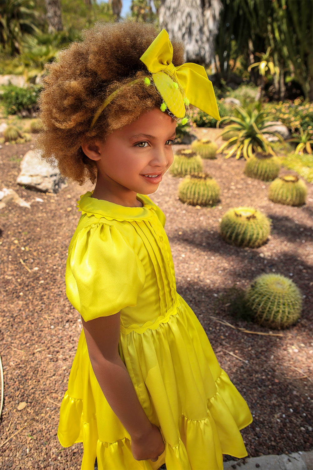 Bright yellow satin dress with pretty front detail, collar and puffed sleeves
