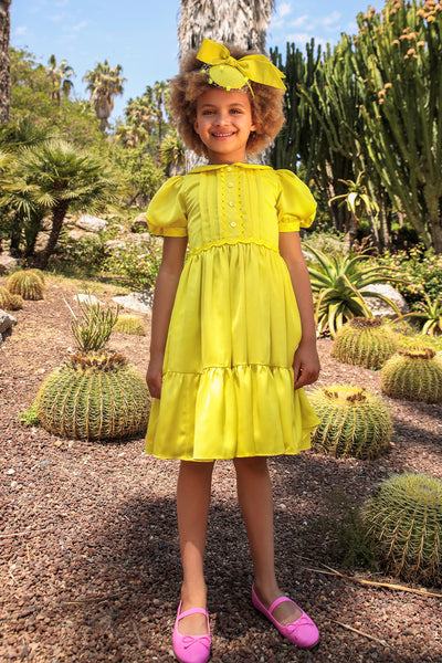 Bright yellow satin dress with pretty front detail, collar and puffed sleeves