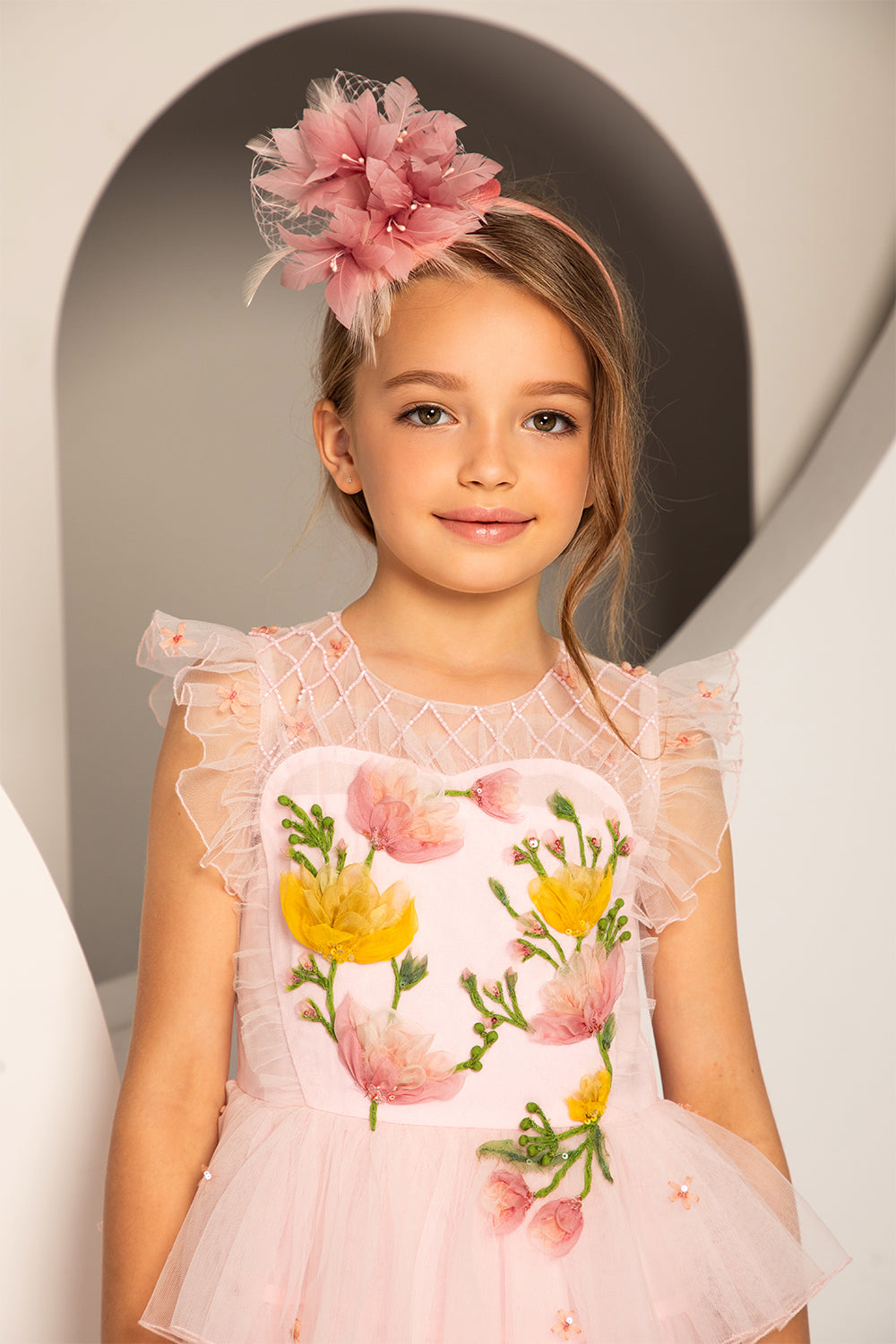 Pale pink layered dress with hand-embroidered flowers