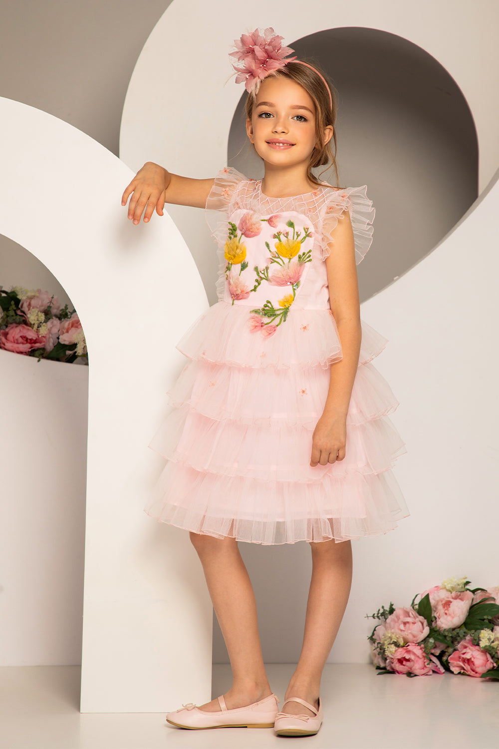 Pale pink layered dress with hand-embroidered flowers