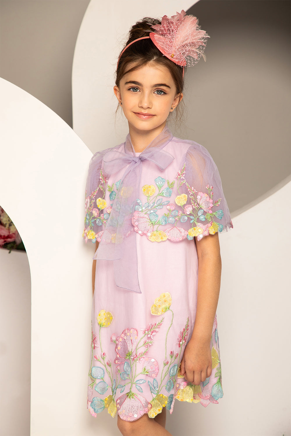 Pale lilac dress with pastel colors floral embroidery and tulle sleeves