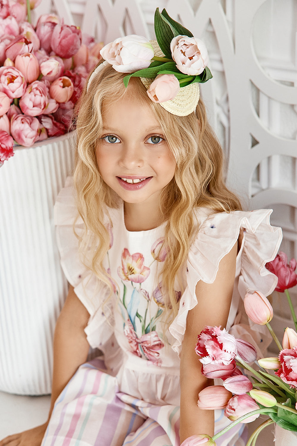 Light pink tulip print satin cotton top with frills and side bows and hand-embellishments