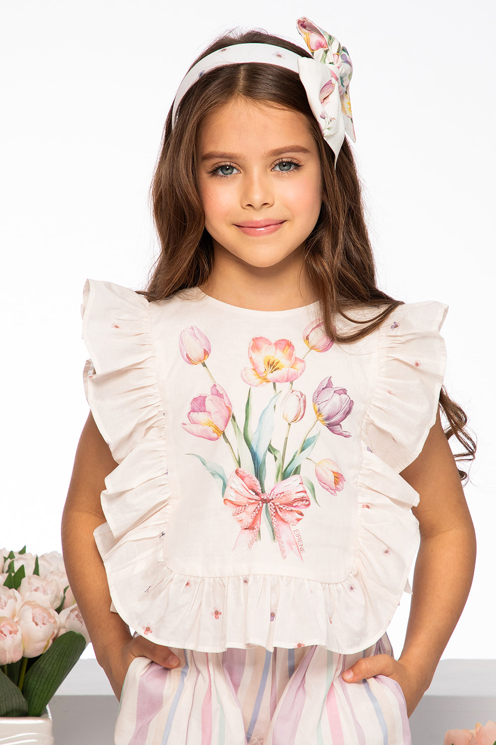 Light pink tulip print satin cotton top with frills and side bows and hand-embellishments