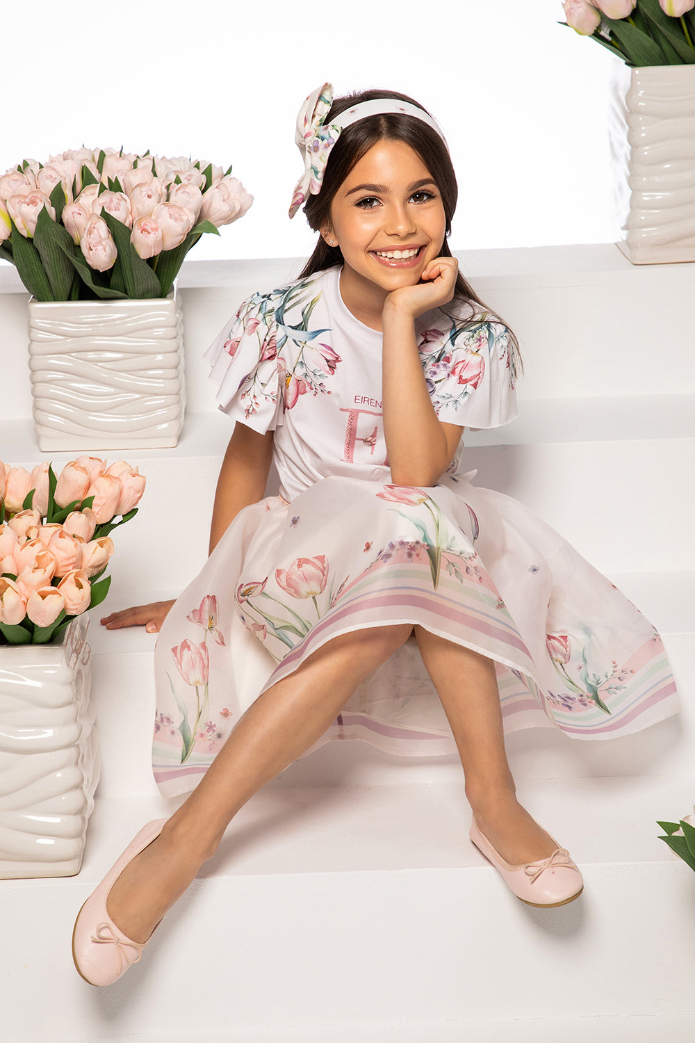 White tulip print t-shirt with hand-embellished logo and bow