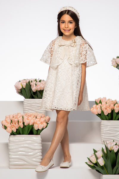 Off-white and gold dress with cape sleeves and metallic bow