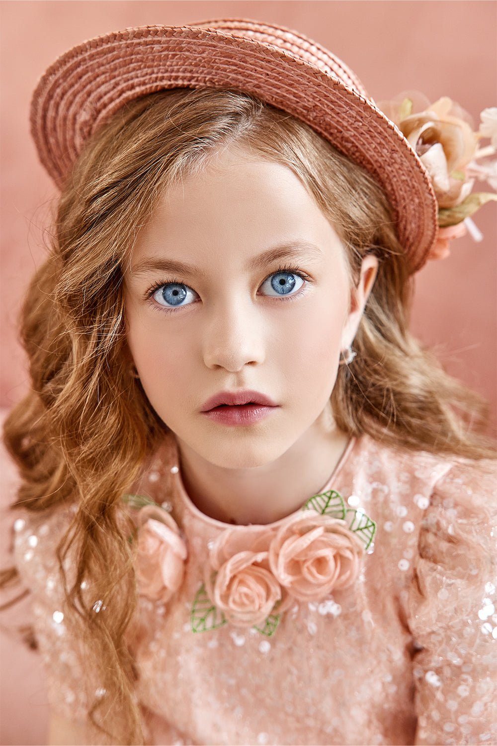 Peach sequin layered dress with flower decorations