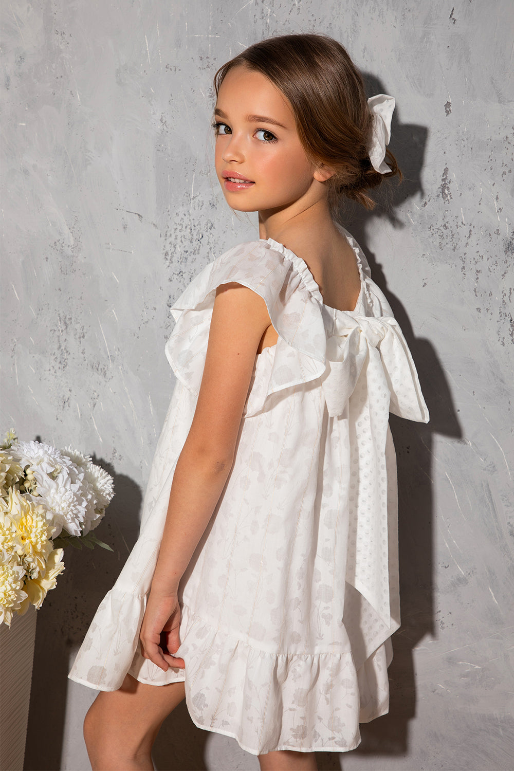 White flowy dress with dots, frills and big bow on the back White flowy dress with dots, frills and big bow on the back