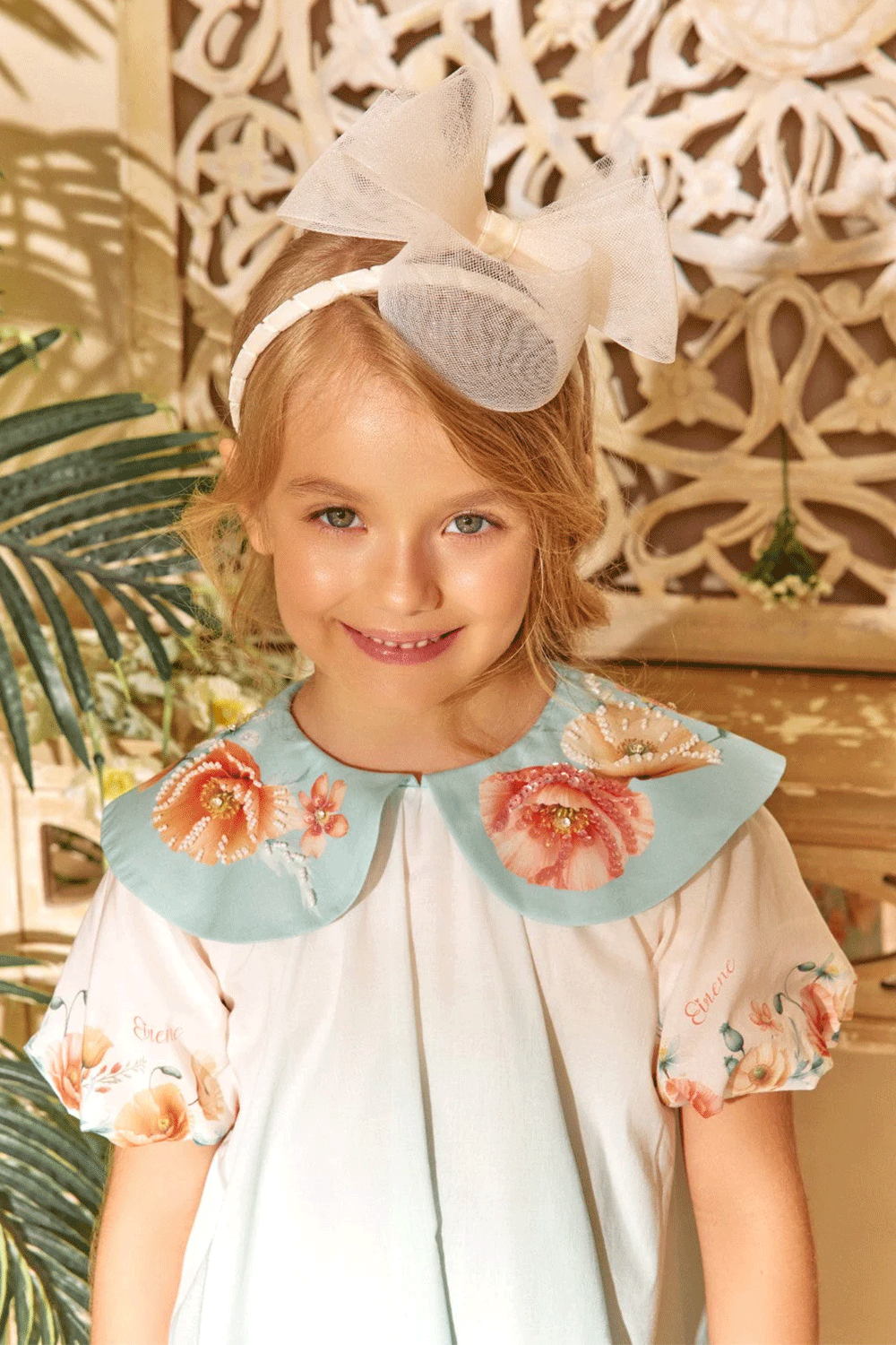 Ombré dress in soft aqua with floral print, puff sleeves, and a hand-embellished collar