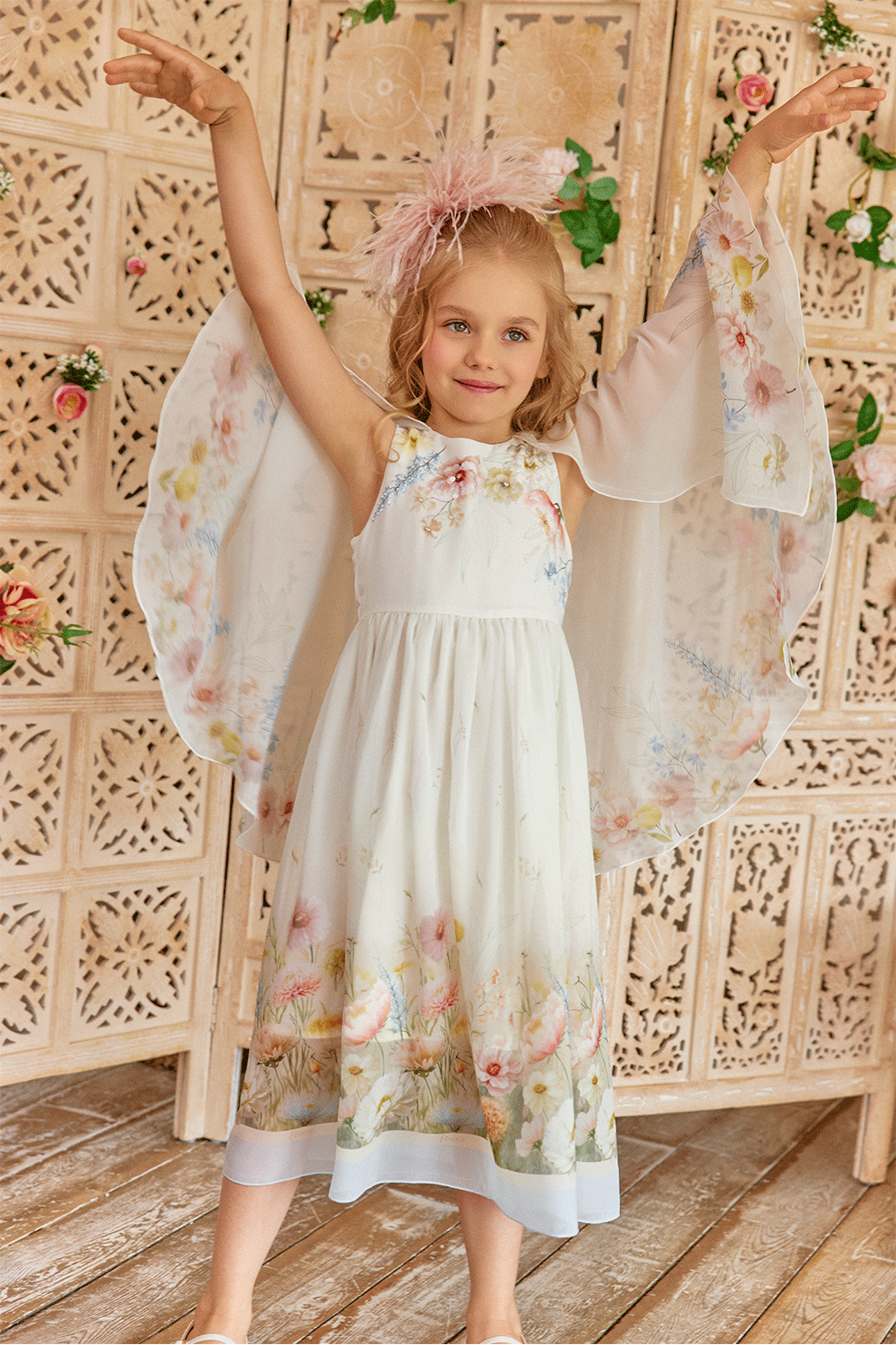 White chiffon dress with floral print, flowing sleeves and delicate hand-embelishement