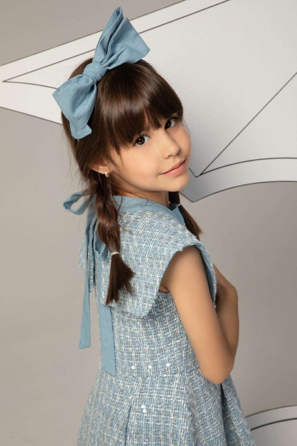 Light blue tweed dress with subtle sequins and double-breasted gold anchor buttons