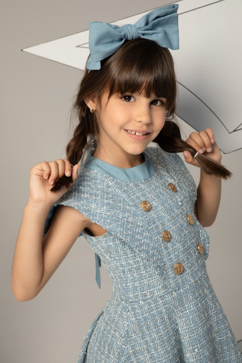 Light blue tweed dress with subtle sequins and double-breasted gold anchor buttons