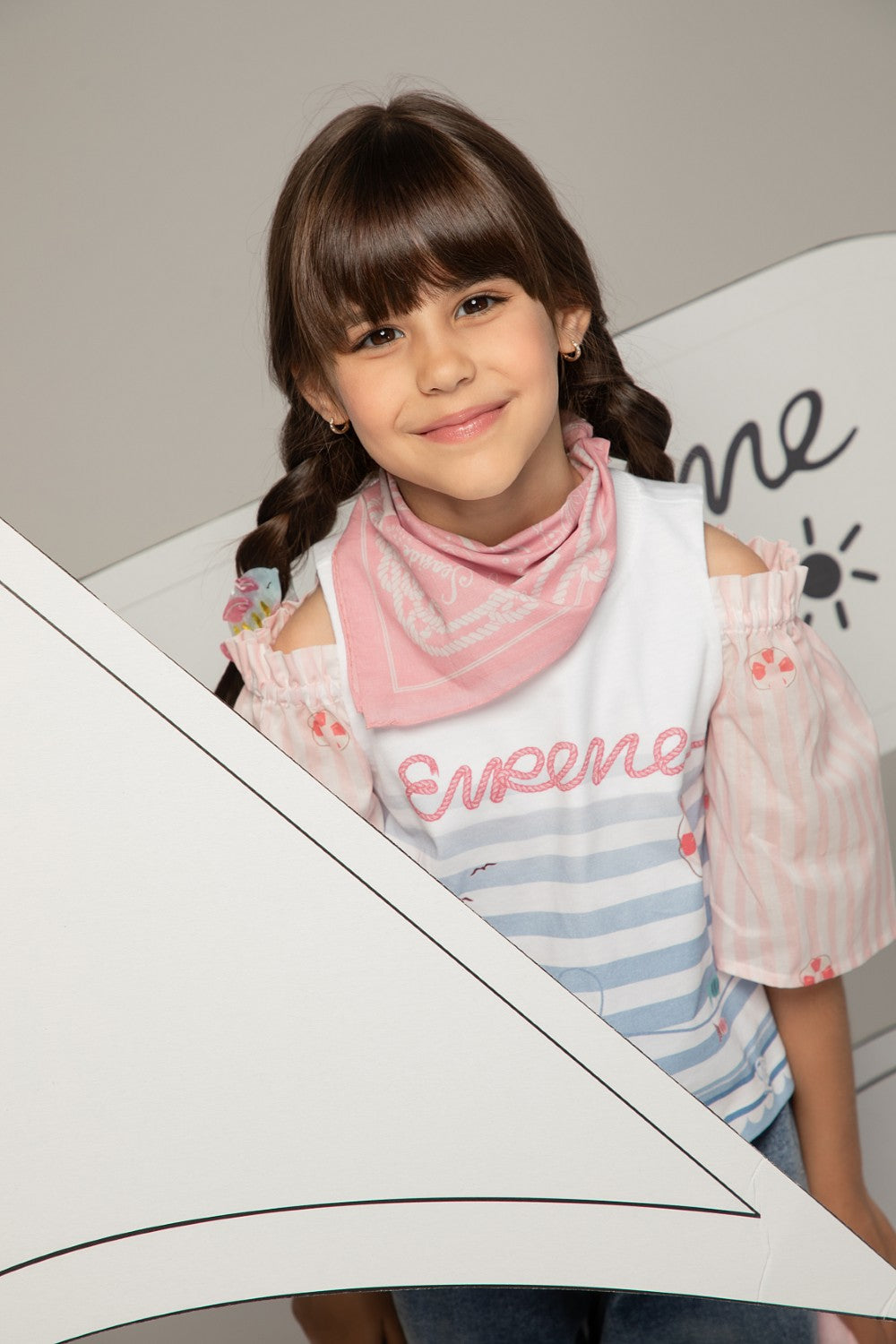 White and pink top with puff sleeves, striped pastel print and Eirene on the front