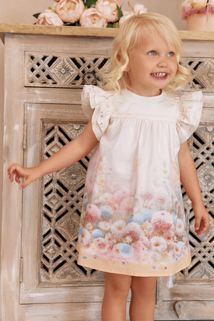 A-line cotton dress with ruffled shoulders and a dreamy pastel floral print