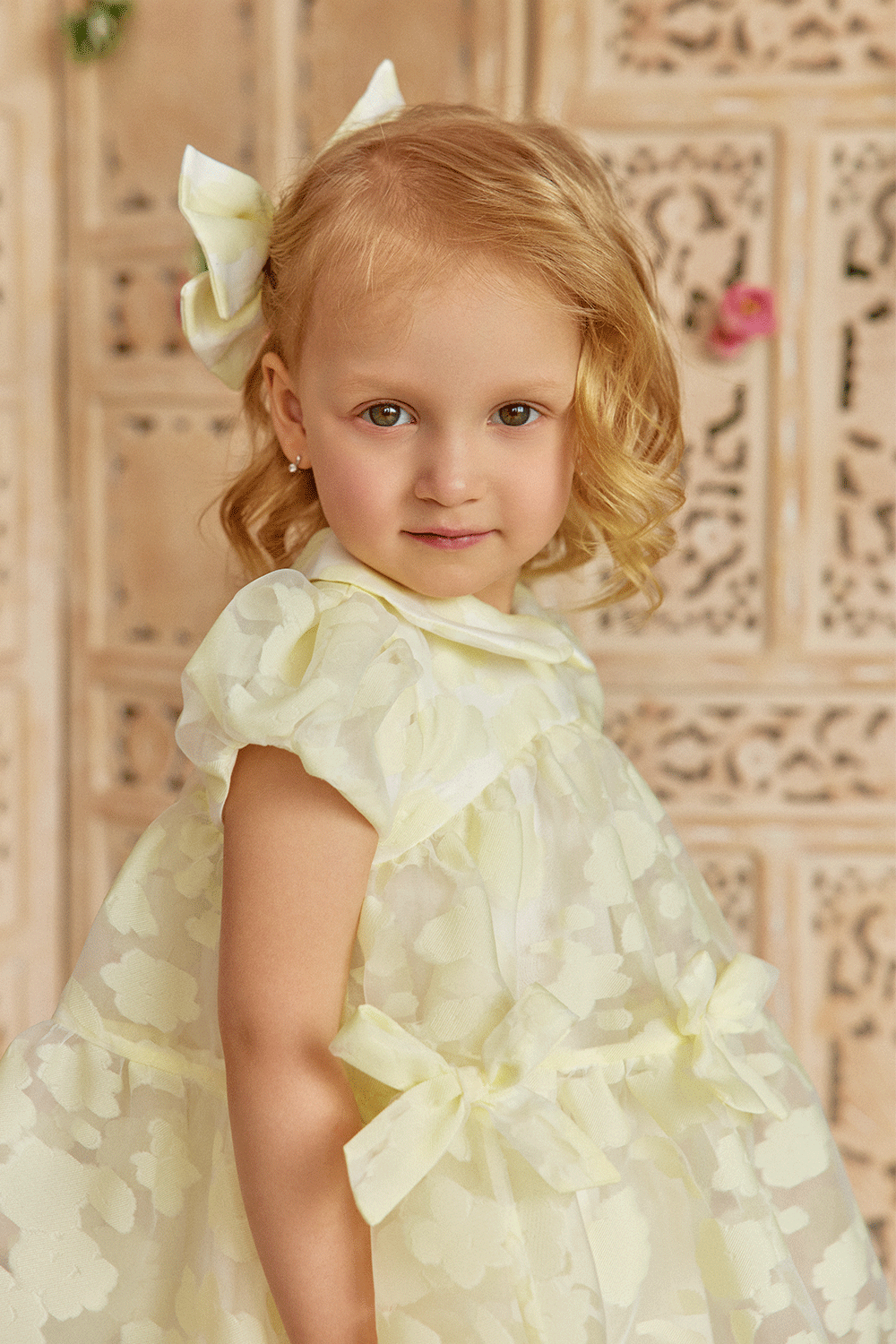 Baby organza dress with oversize bow, puff sleeves and bows