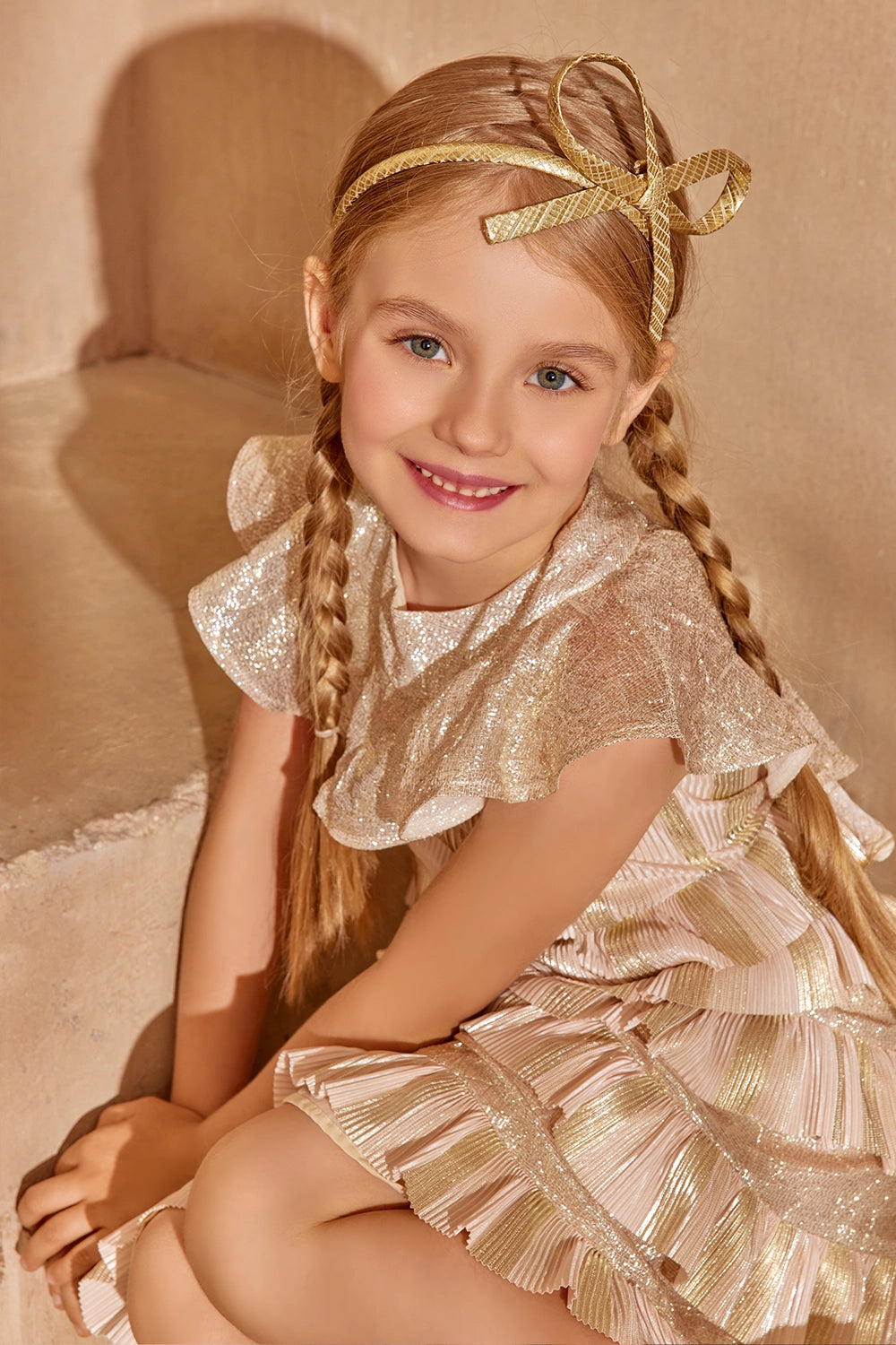 Gold and blush pleated ruffle dress with shimmer details and bow