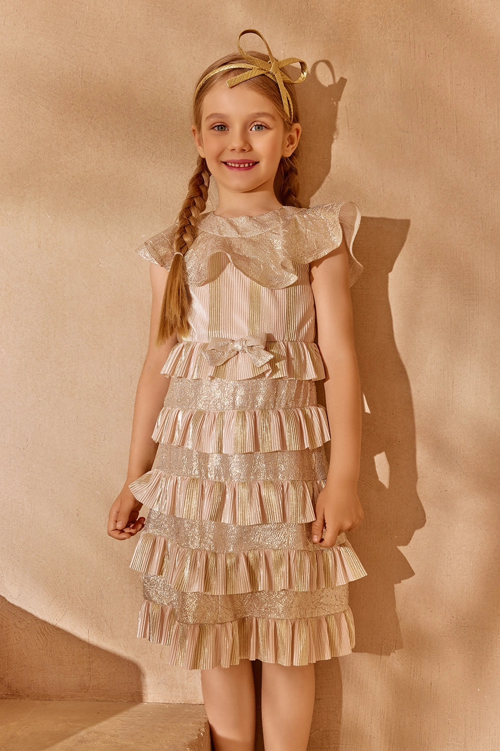 Gold and blush pleated ruffle dress with shimmer details and bow