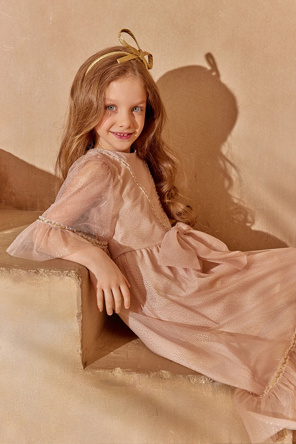 Dusty pink glitter tulle dress with flounced sleeves and a big bow