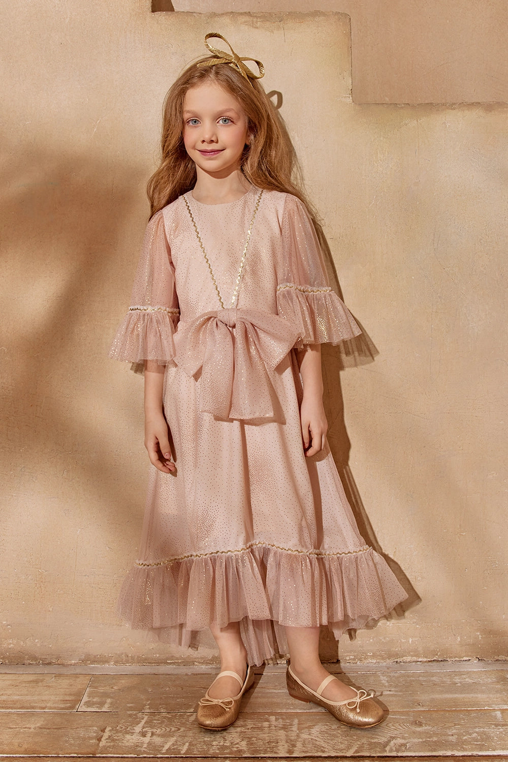 Dusty pink glitter tulle dress with flounced sleeves and a big bow