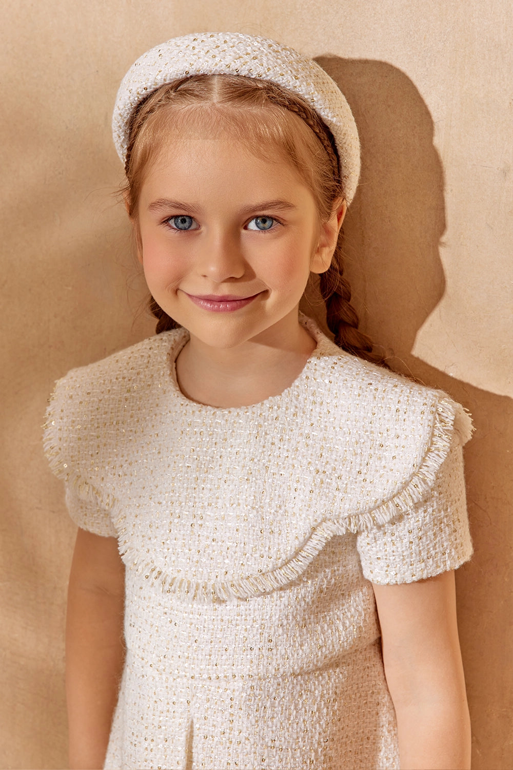Elegant white tweed dress with pleated front and fringe trim