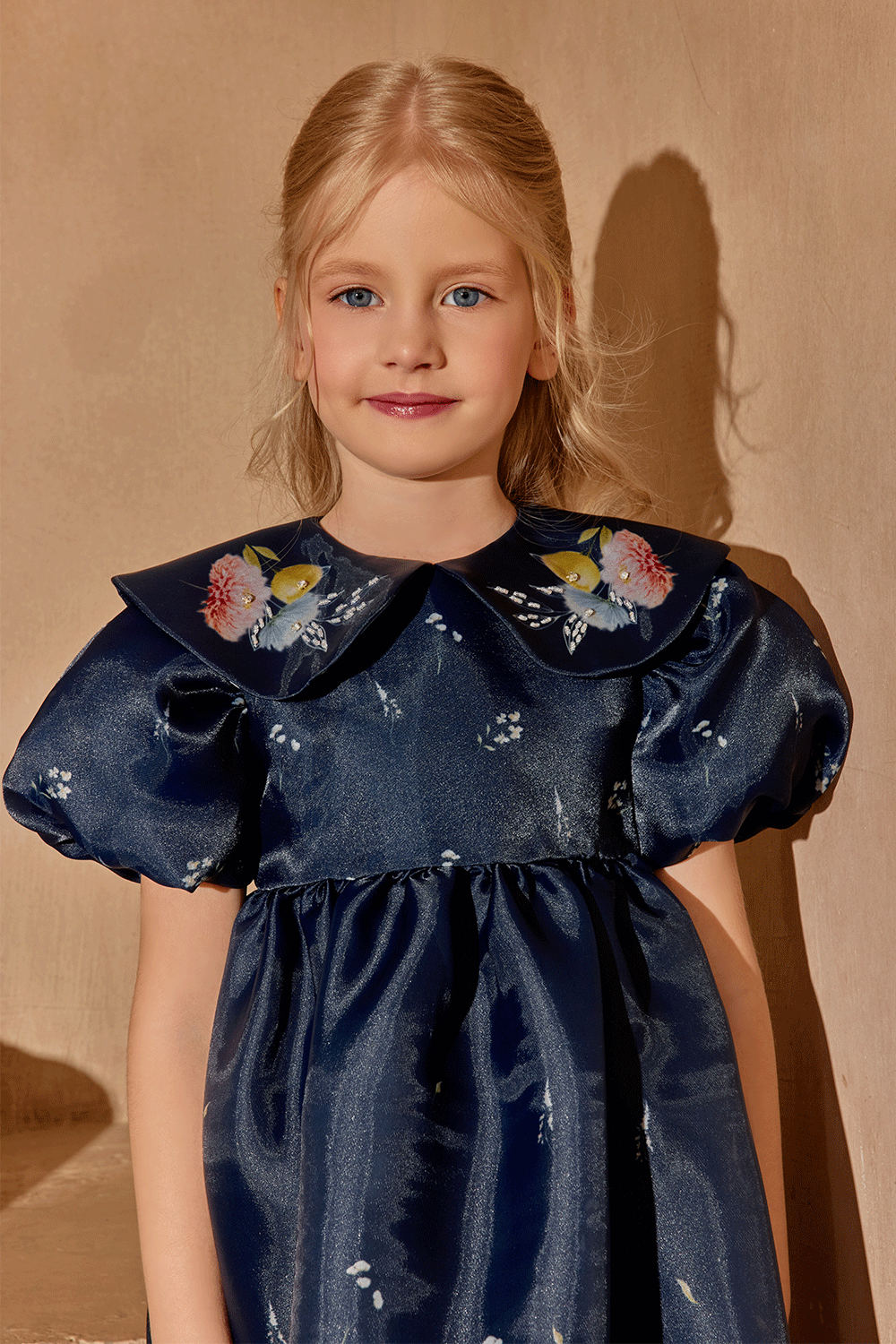 Midnight floral dress with short puffed sleeves and hand-embelished collar