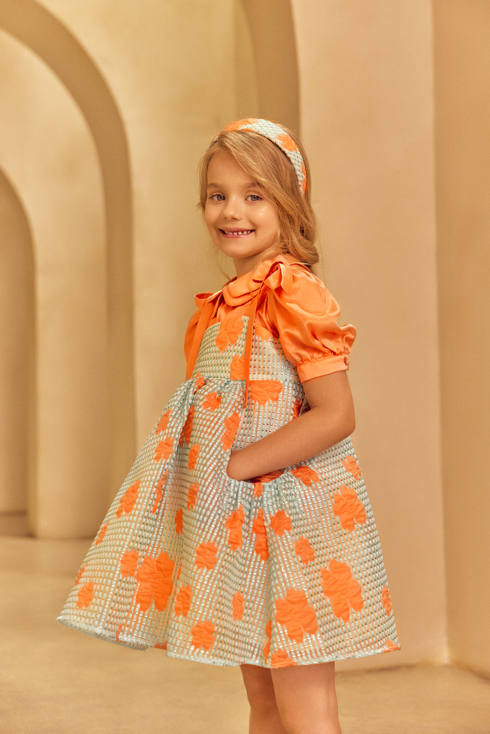 SmilIng girl wearing Аqua jacquard organza dress