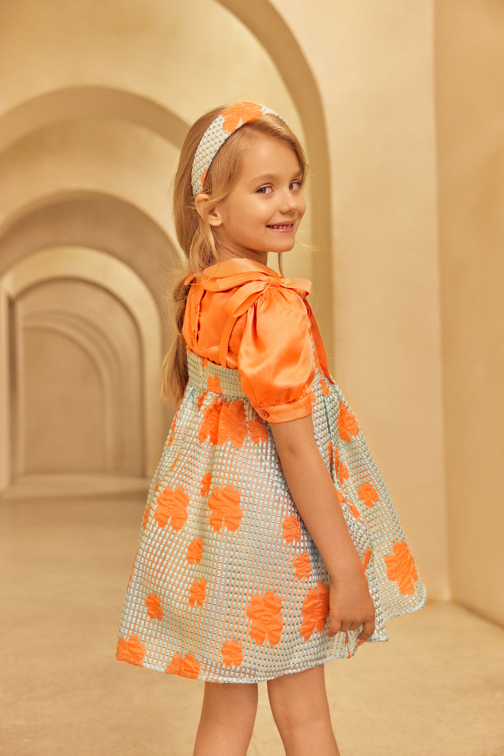 Girl wearing Аqua jacquard organza dress and headband.
