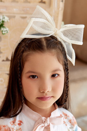 Ivory mesh bow hairband with a soft, sheer finish