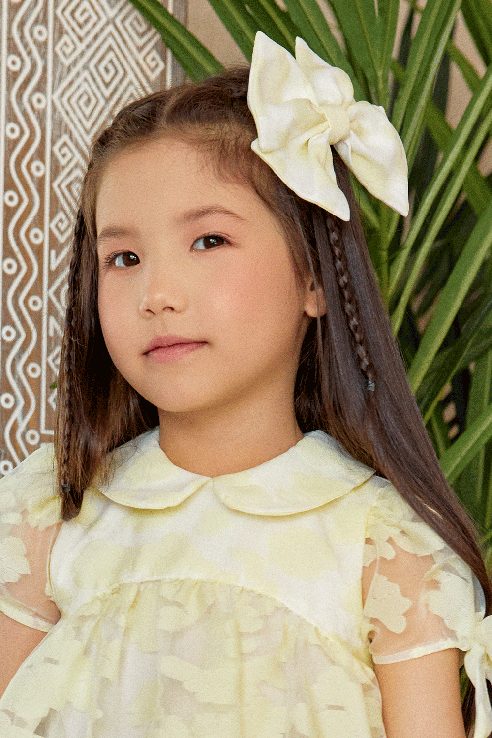 Oversized pale yellow bow hair clip in floral organza