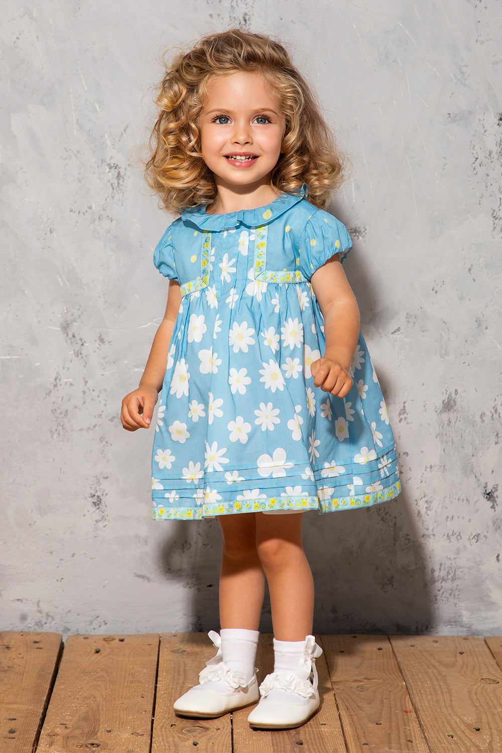 Blue satin cotton baby dress with white daisies