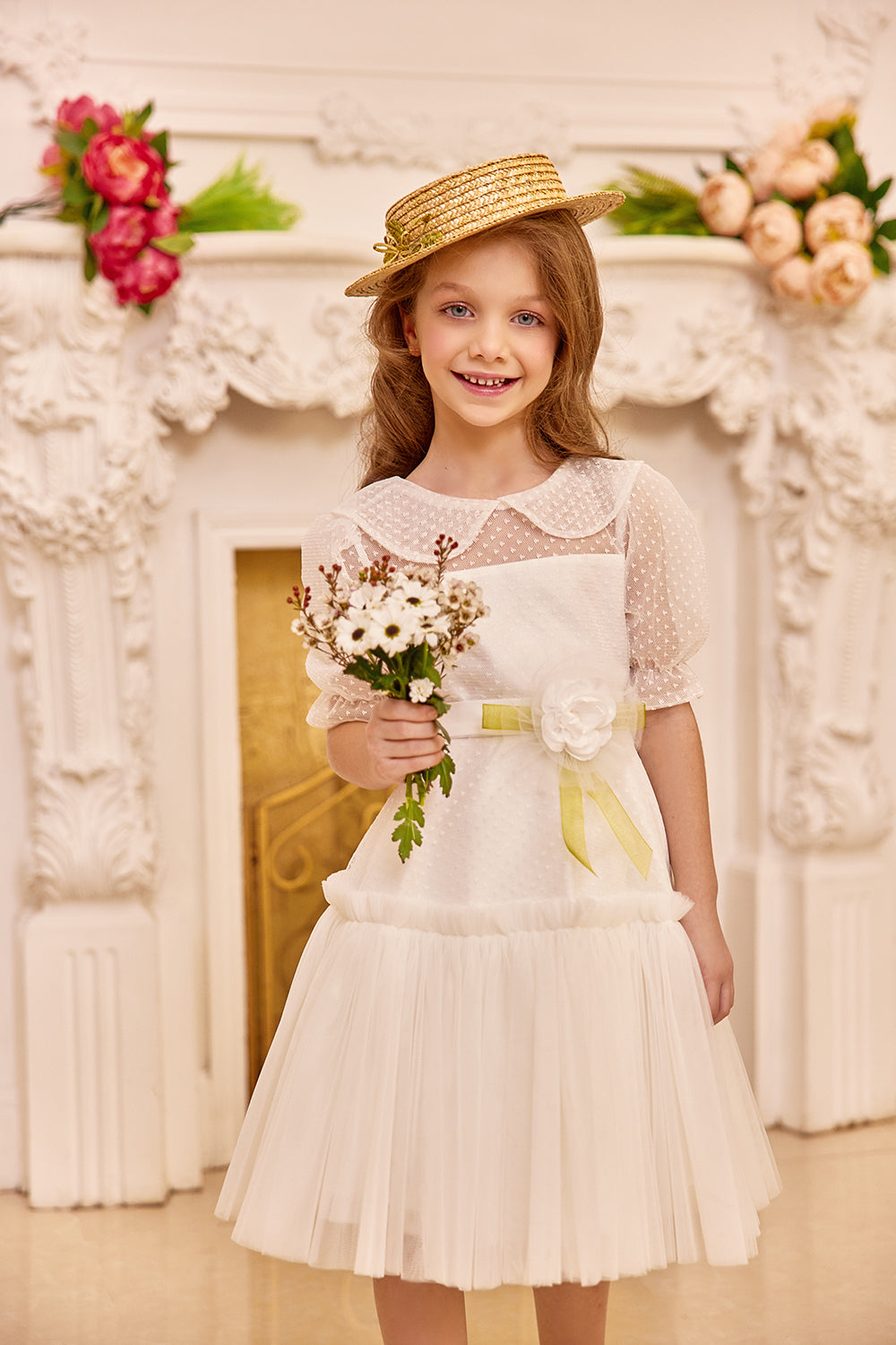 White tulle dress with green bow and flower