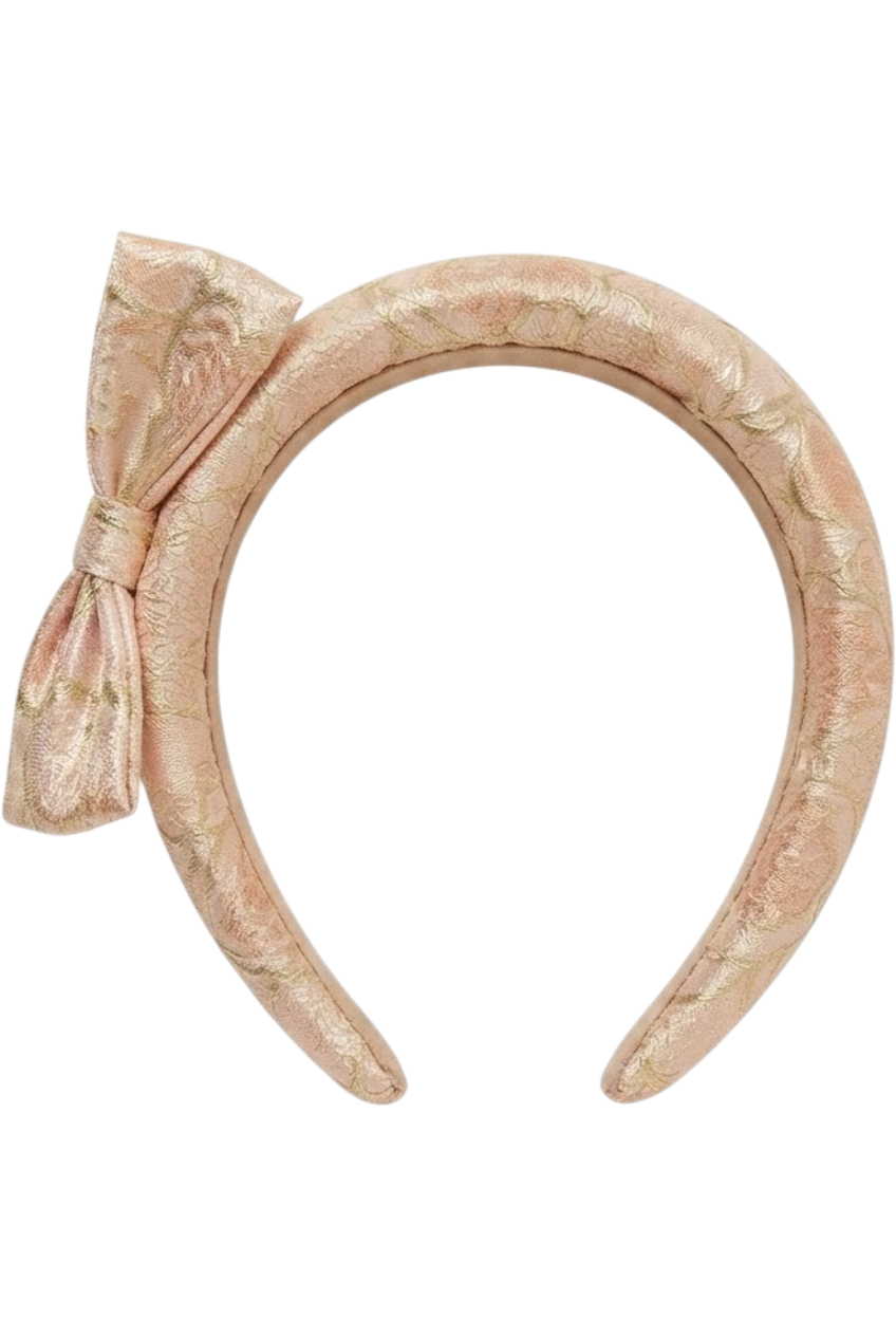 Padded brocade headband in soft gold-pink tones - product view