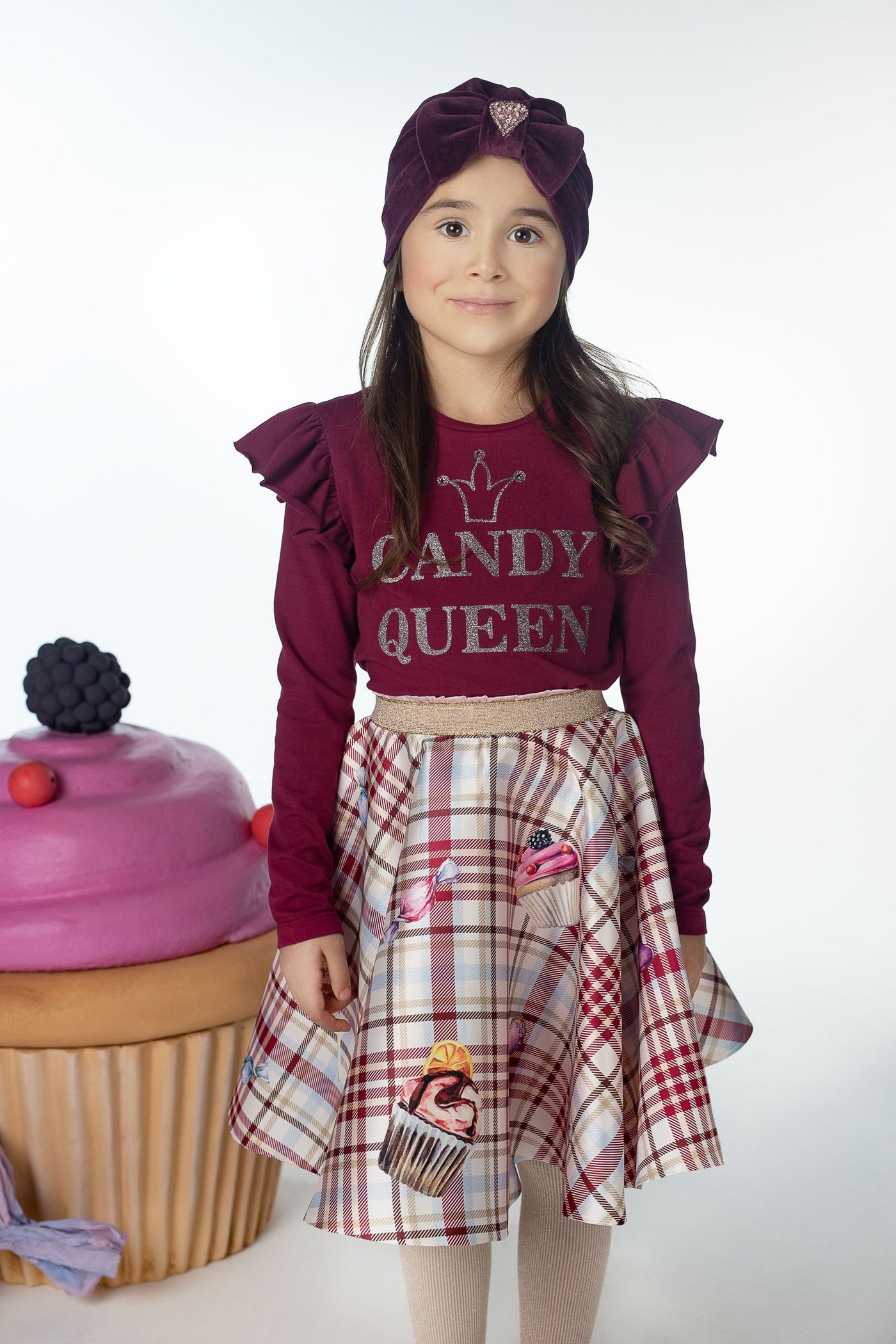 Checkered off-white and burgundy skirt with candies print