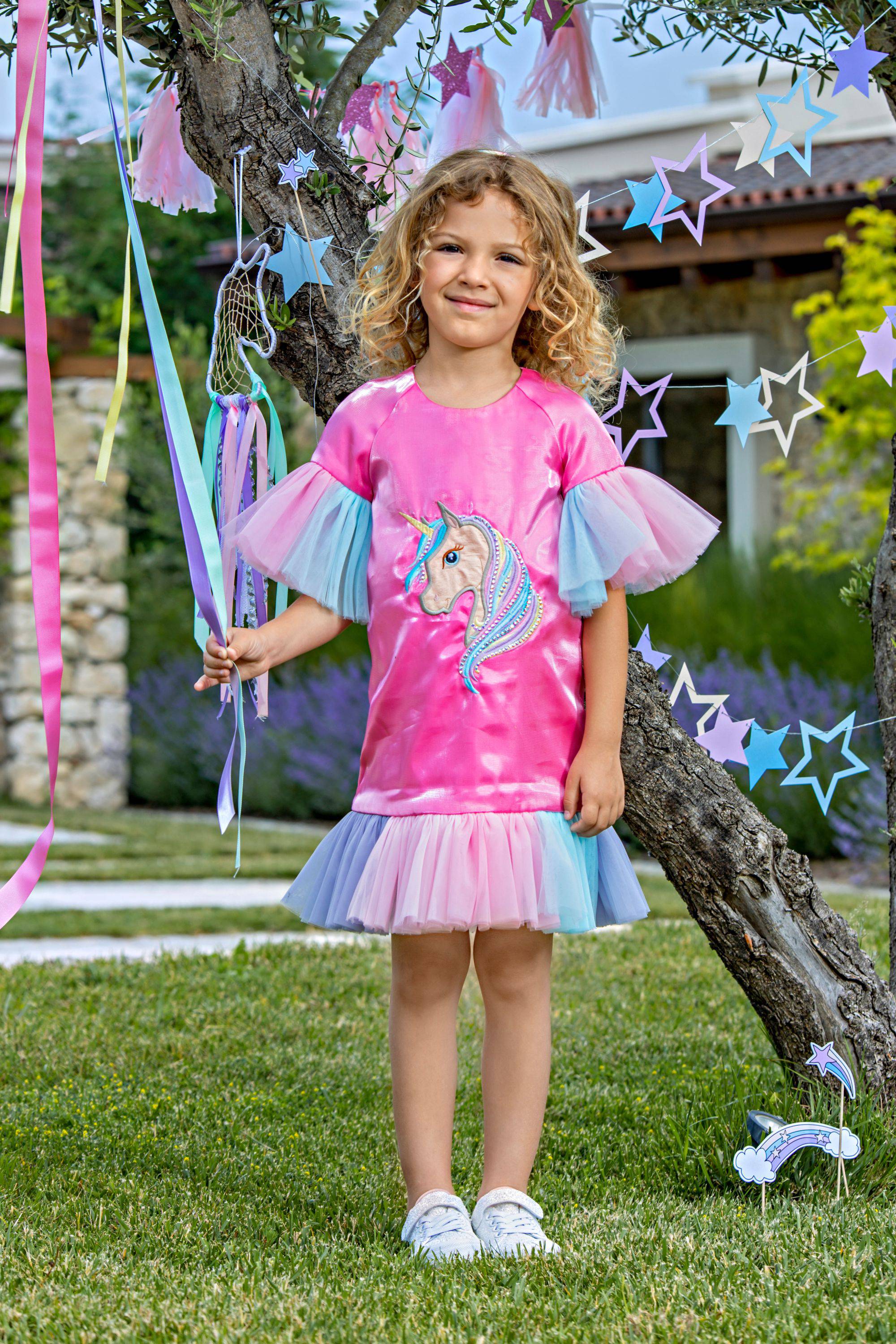 Fuchsia satin dress with unicorn embroidery, tulle frills and Swarovski crystals