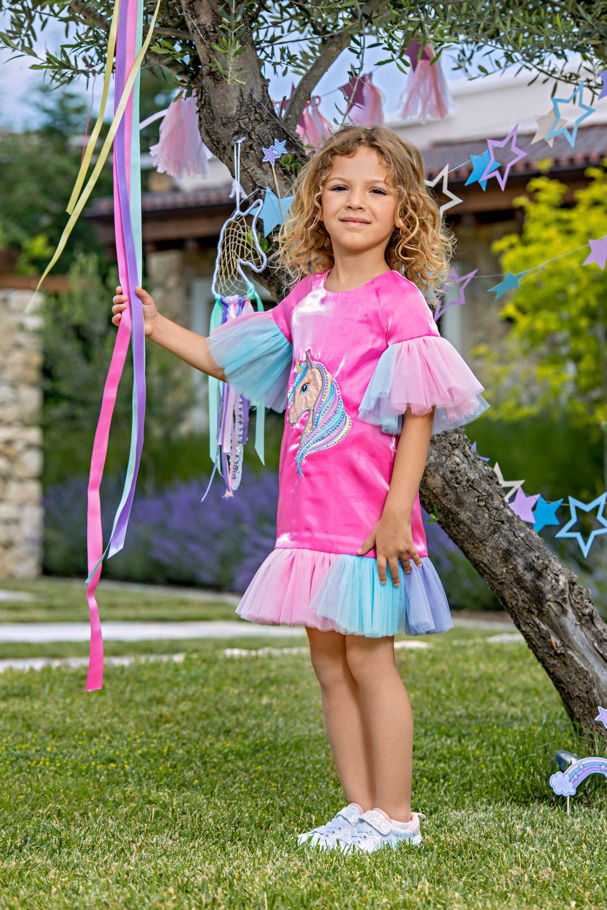 Fuchsia satin dress with unicorn embroidery, tulle frills and Swarovski crystals