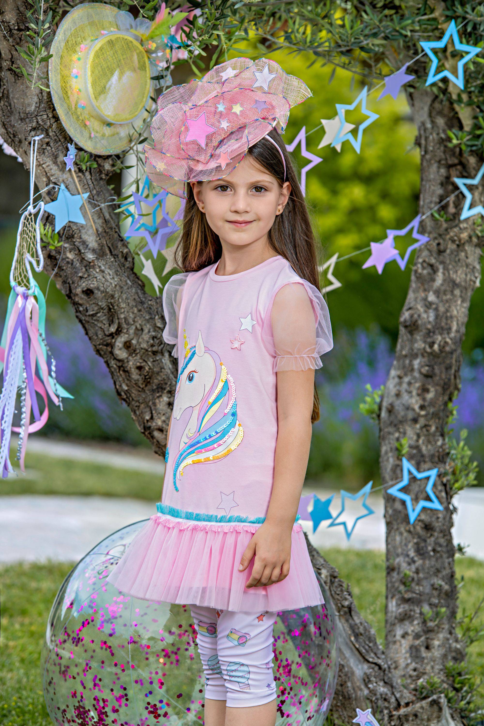 Pink jersey tunic dress with hand-embellished unicorn and tulle sleeves and frills
