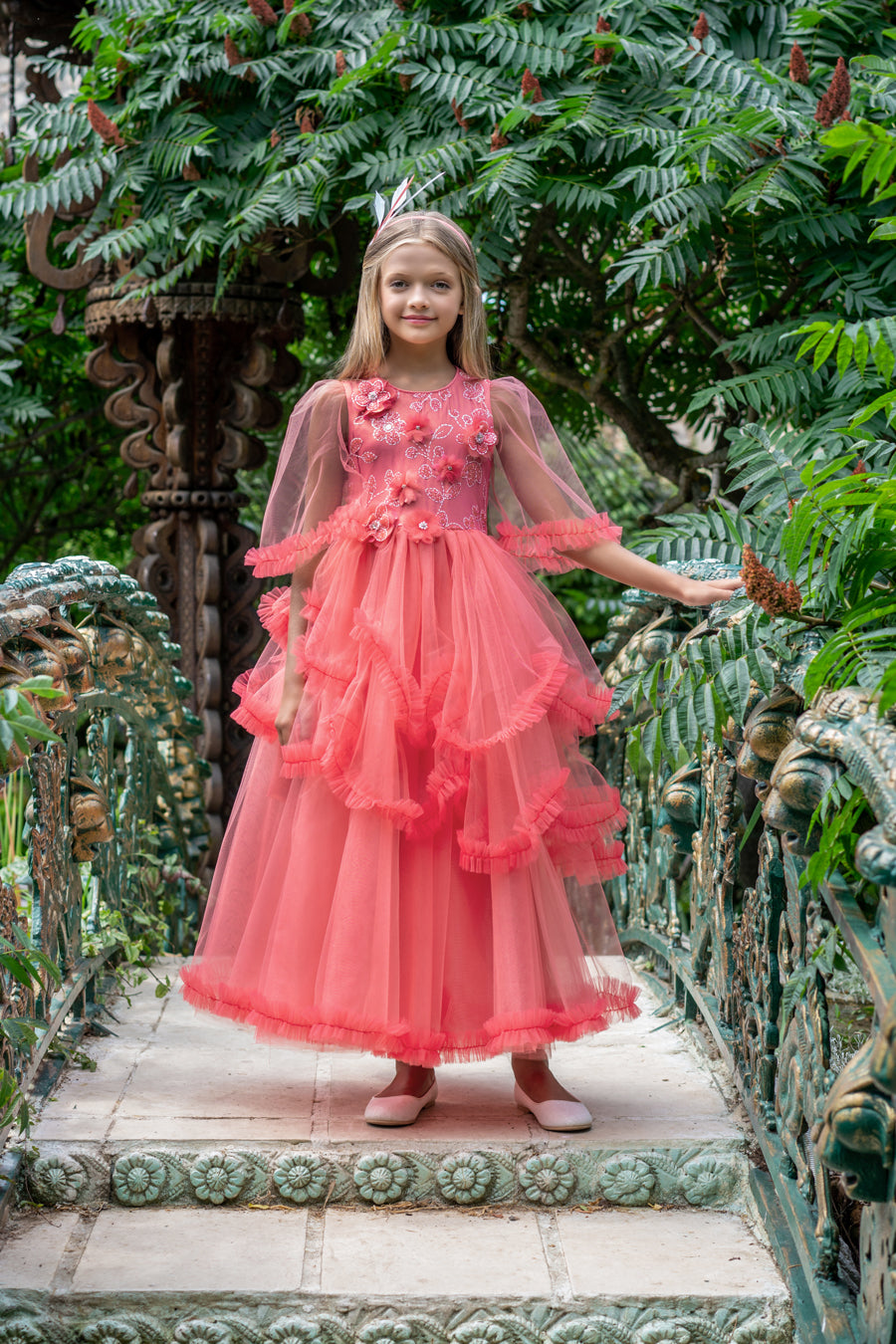 Puffed long coral tulle dress with hand-made shimmering flowers