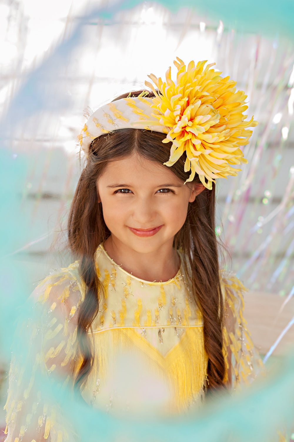 Yellow headband with a flower
